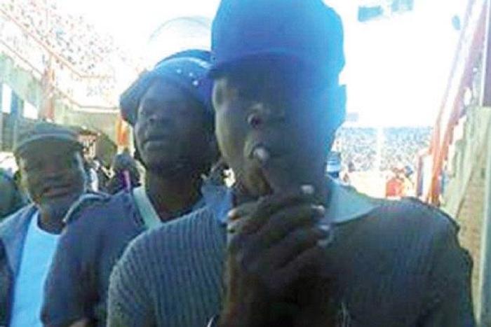 Bishop Mwembe in handcuffs