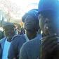 Bishop Mwembe in handcuffs