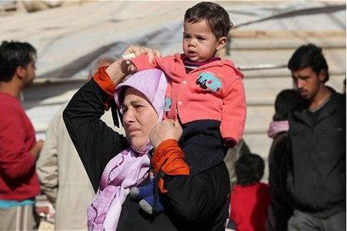 Britain says will take in hundreds more women and children from Syria
