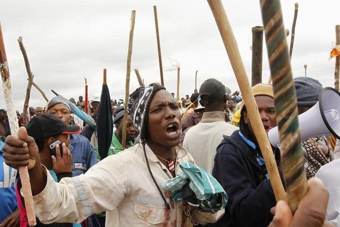 Striking miners chant slogans as they gather at the AngloGold Ashanti mine in Carletonville, northwest of Johannesburg October 24, 2012.  
REUTERS/Siphiwe Sibeko