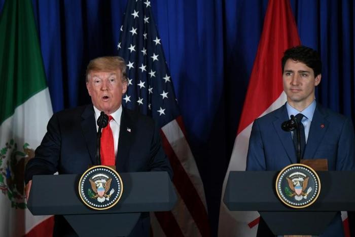 US President Donald Trump and Canadian Prime Minister Justin Trudeau, pictured at a G20 summit on November 30, 2018, agreed to continue to seek the release of the arrested Canadians