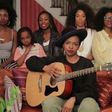 Lauryn Hill and some members of her band singing her hit song, That Thing