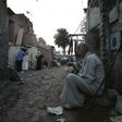 A man eats outside his shanty on World Poverty Day in a Cairo slum, in a file photo. REUTERS/Nasser Nuri