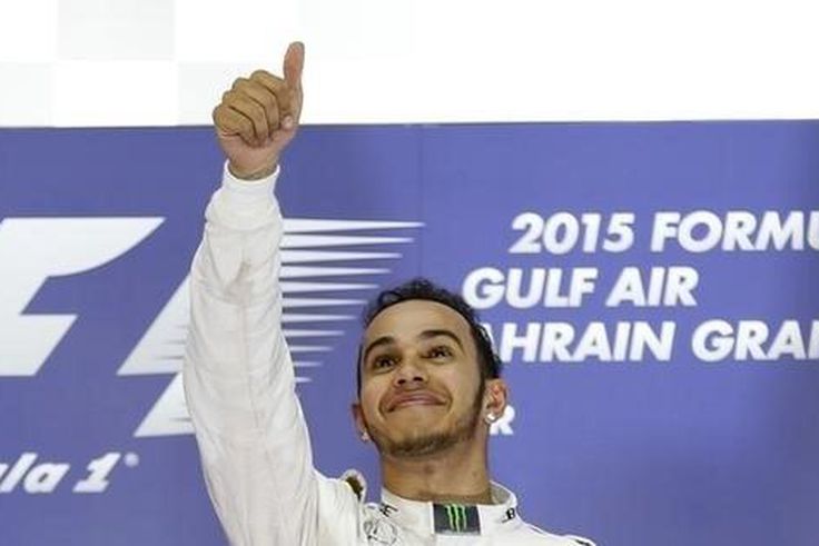 Mercedes Formula One driver Lewis Hamilton of Britain celebrates his victory on the podium after Bahrain's F1 Grand Prix at Bahrain International Circuit, south of Manama April 19, 2015.   REUTERS/Ahmed Jadallah