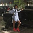 Busola Dakolo sports a boyfriend shirt over shorts and high top sneakers