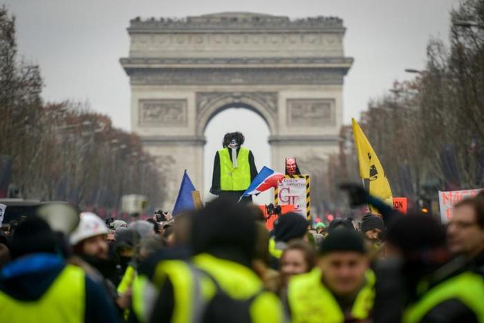 Hundreds of 'yellow vest' protesters took to the Champs-Elysees on Saturday