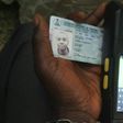 A Permanent Voter's Card being tested on a card reader meant for use in Nigeria's upcoming general elections.