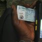 A Permanent Voter's Card being tested on a card reader meant for use in Nigeria's upcoming general elections.