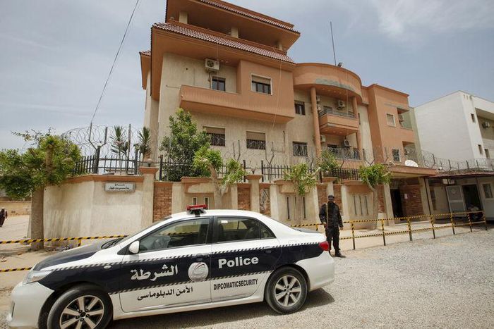 A police vehicle is seen parked in front of the Tunisian consulate in Tripoli, Libya June 13, 2015.  REUTERS/Ismail Zitouny