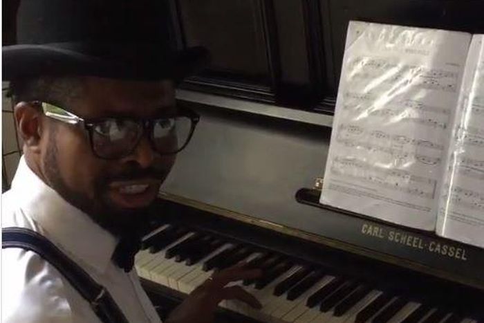 Basketmouth playing the piano