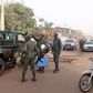 Soldiers gesture in front of La Terrasse restaurant where militants killed five people, including a French citizen and a Belgian citizen, in a gun attack in Bamako March 7, 2015.   REUTERS/Adama Diarra