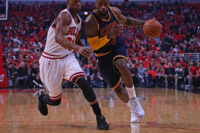 Chicago, IL, USA; Cleveland Cavaliers forward LeBron James (23) dribbles the ball as Chicago Bulls guard Jimmy Butler (21) defends in the first quarter of game four of the second round of the NBA Playoffs at the United Center. Mandatory Credit: Dennis ...