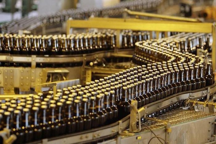 Bottles of beer move along a production line at the South African Brewery in Alrode  in a file photo.     REUTERS/Siphiwe Sibeko