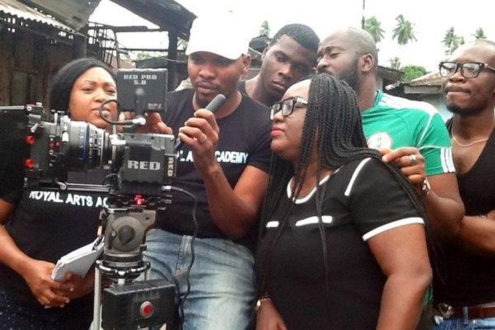 Austin Nwaolie handling the camera while Desmond Elliot and Emem Isong give directions