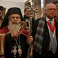 Jerusalem's Greek Orthodox Patriarch Theophilos III (C), arrives at the Church of the Nativity in the occupied West Bank town of Bethlehem, to celebrate the Christmas mass with his community, on January 6, 2019