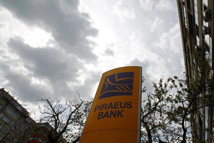 The logo of Piraeus Bank is seen outside one of its branches in Bucharest April 18, 2013. REUTERS/Bogdan Cristel