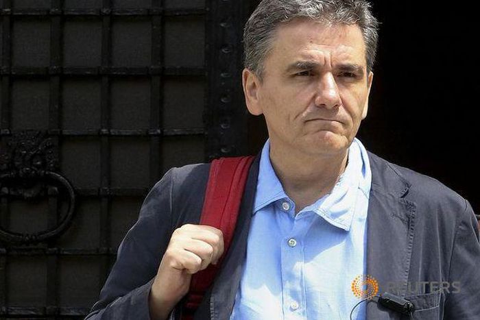 Greek finance minister says 'minor issues' pending with lenders