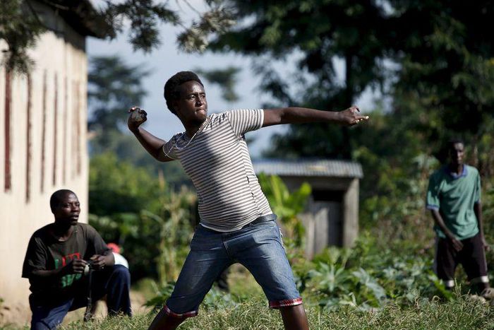 A protester throws stones at police during a protest against president Pierre Nkurunziza in Bujumbura, Burundi, May 10. 2015. East African leaders will hold a summit in Tanzania on May 13 aimed at breaking the political deadlock in Burundi and ensuring...