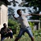 A protester throws stones at police during a protest against president Pierre Nkurunziza in Bujumbura, Burundi, May 10. 2015. East African leaders will hold a summit in Tanzania on May 13 aimed at breaking the political deadlock in Burundi and ensuring...