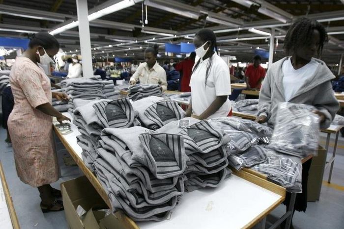 Kenyan workers pack clothes for export at the Alltex export processing zone (EPZ) factory in Athi River, near the Kenyan capital Nairobi, July 31, 2009. REUTERS/Thomas Mukoya