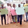 Abuja bomb blast victims protest outside National Assembly in Abuja.