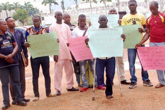 Abuja bomb blast victims protest outside National Assembly in Abuja.