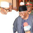 President Goodluck Jonathan and Gen. Muhammadu Buhari share a good laugh