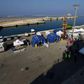 Migrants rescued by Italy say up to 50 missing after boat sinks