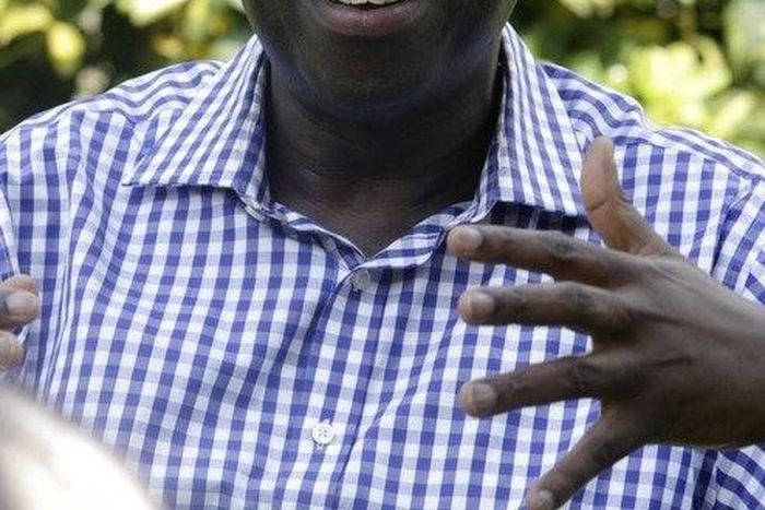 Uganda's main opposition leader Kizza Besigye talks during an interview with Reuters at his home in Kasangati near Kampala, January 13, 2012.   REUTERS/James Akena