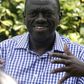 Uganda's main opposition leader Kizza Besigye talks during an interview with Reuters at his home in Kasangati near Kampala, January 13, 2012.   REUTERS/James Akena