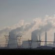 A truck drives past electricity pylons at the Lethabo Power Station in the Free State Province, about 70km (43 miles) south of Johannesburg, November 27, 2011.  
 REUTERS/Siphiwe Sibeko