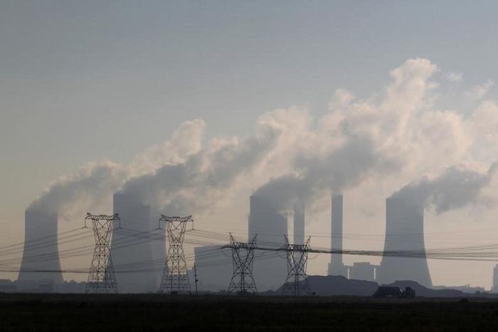 A truck drives past electricity pylons at the Lethabo Power Station in the Free State Province, about 70km (43 miles) south of Johannesburg, November 27, 2011.    
 REUTERS/Siphiwe Sibeko