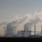 A truck drives past electricity pylons at the Lethabo Power Station in the Free State Province, about 70km (43 miles) south of Johannesburg, November 27, 2011.    
 REUTERS/Siphiwe Sibeko