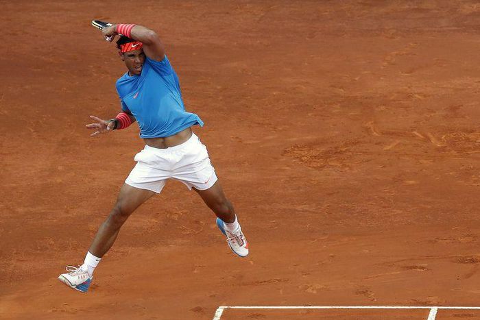 Spain's Rafael Nadal returns the ball to Britain's Andy Murray during their final match against the Madrid Open tennis tournament in Madrid, Spain, May 10, 2015. REUTERS/Andrea Comas