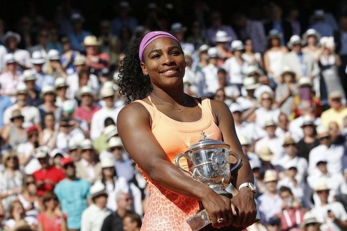 Serena Williams of the U.S. poses with the trophy during the ceremony after defeating Lucie Safarova of the Czech Republic during their women's singles final match to win the French Open tennis tournament at the Roland Garros stadium in Paris, France, ...
