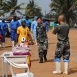 Liberia's last known Ebola patient Beatrice Yardolo (in yellow) arrives for a ceremony at the Chinese Ebola treatment unit, where she was treated, in Monrovia, Liberia, March 5, 2015. REUTERS/James Giahyue/Files