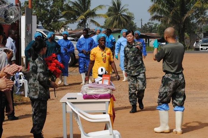Liberia's last known Ebola patient Beatrice Yardolo (in yellow) arrives for a ceremony at the Chinese Ebola treatment unit, where she was treated, in Monrovia, Liberia, March 5, 2015. REUTERS/James Giahyue/Files