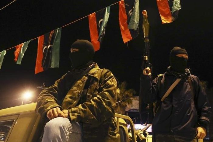 Members of a heavily-armed militia group hold their weapons in Freedom Square in Benghazi February 18, 2014.   
REUTERS/Esam Omran Al-Fetori