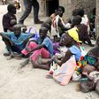 Residents displaced due to the recent fighting between government and rebel forces in the Upper Nile capital Malakal wait at a World Food Program (WFP) outpost where thousands have taken shelter in Kuernyang Payam, South Sudan May 2, 2015. REUTERS/Deni...