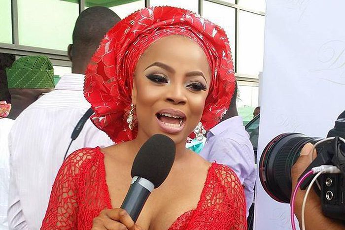 Toke Makinwa looking stunning in her red Aso Ebi
