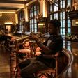 A musician plays at the bar of the Rand Club, the imposing Edwardian-style club in Johannesburg's vibrant centre
