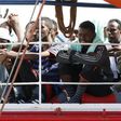 Migrants wait to disembark from the Panamanian ship Dignity 1 in the Sicilian harbour of Pozzallo, Italy, June 23, 2015. REUTERS/Antonio Parrinello