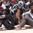 Migrants wait to be transported to an immigration centre in the coastal city of Misrata, Libya, May 9, 2015. REUTERS/Ismail Zitouny