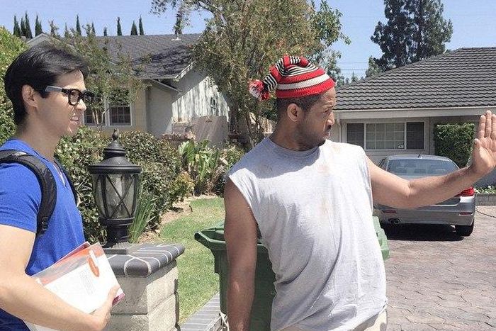 Mike Ezuruonye and a Chinese actor on the movie set