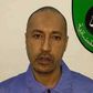 Saadi Gaddafi, son of Muammar Gaddafi, looks on inside a prison in Tripoli in this handout photograph provided by the prison's relations department on March 6, 2014.  REUTERS/Prison Media Office/Handout via Reuters