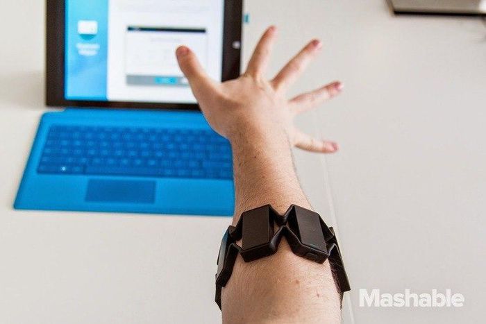 The Myo control armband in use.