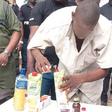 Isah Buruku showing the police how he misses his drugs.