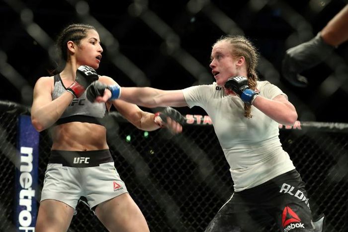 Polyana Viana (left), seen here in a bout against JJ Aldrich in August 2018, brought the hapless perp down with two punches and a kick and held him in a "rear-naked choke" before making him sit and wait for the police