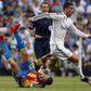 Real Madrid's Cristiano Ronaldo (R) runs past Valencia's Nicolas Otamendi on the ground during their Spanish first division soccer match at Santiago Bernabeu stadium in Madrid, Spain, May 9, 2015.  REUTERS/Paul Hanna      TPX IMAGES OF THE DAY