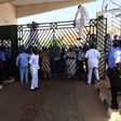 Legislators scaling the fence of the National Assembly complex